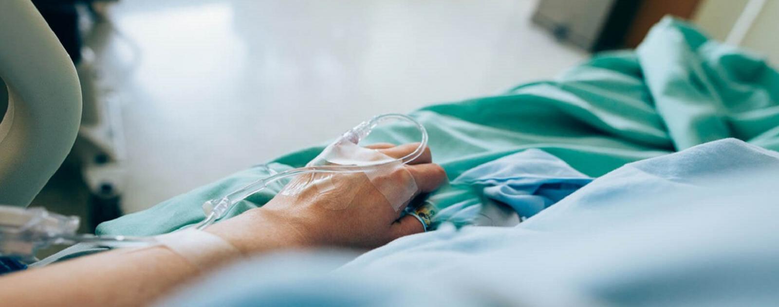 1626315075669466.jpg patient-lying-medical-bed-iv-catheter.jpg